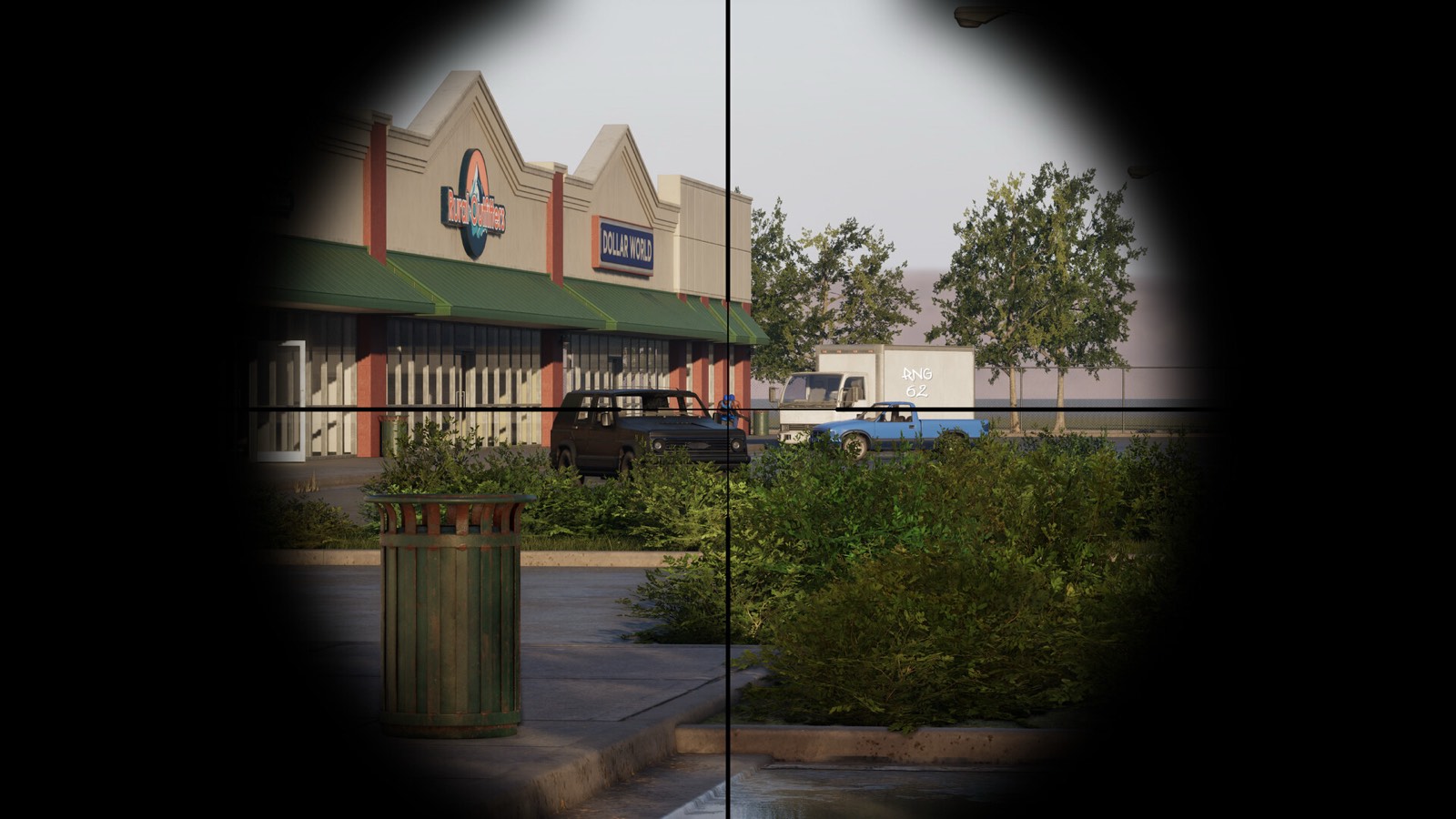 A sniper scope looks across a parking lot toward a strip mall, a truck, and a blue pickup.